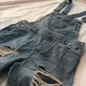 Boutique distressed overalls.